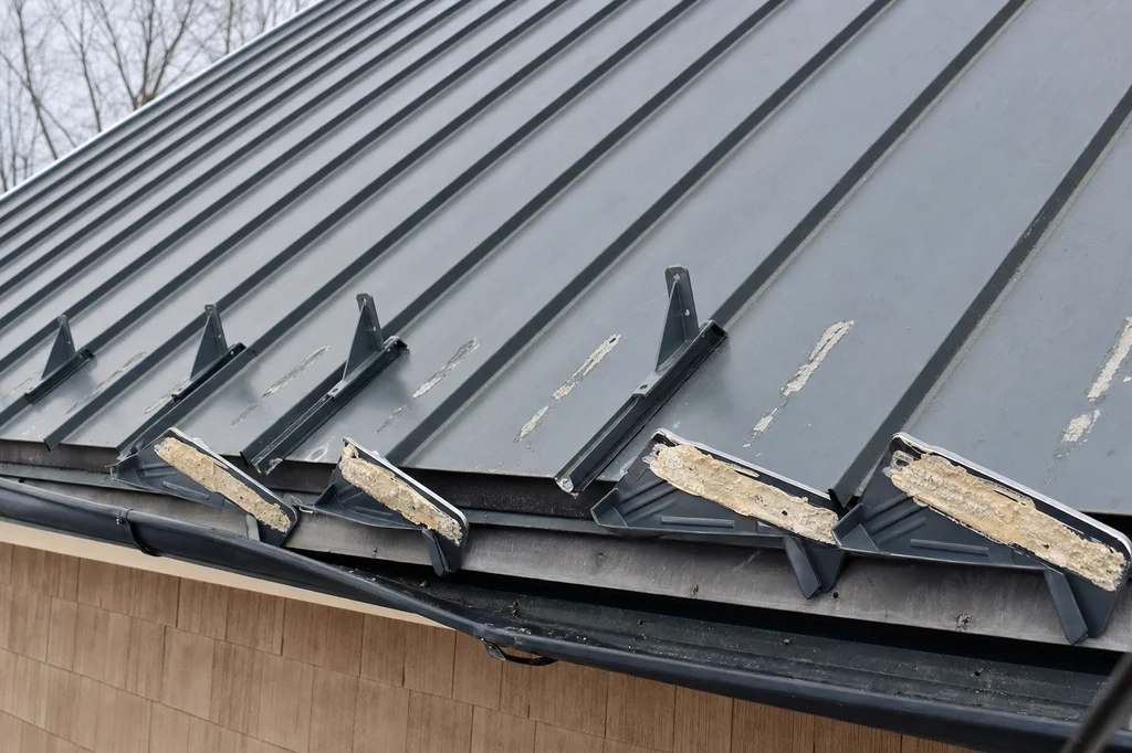 Why Adhesive Snow Guards Can Fall Off a Metal Roof